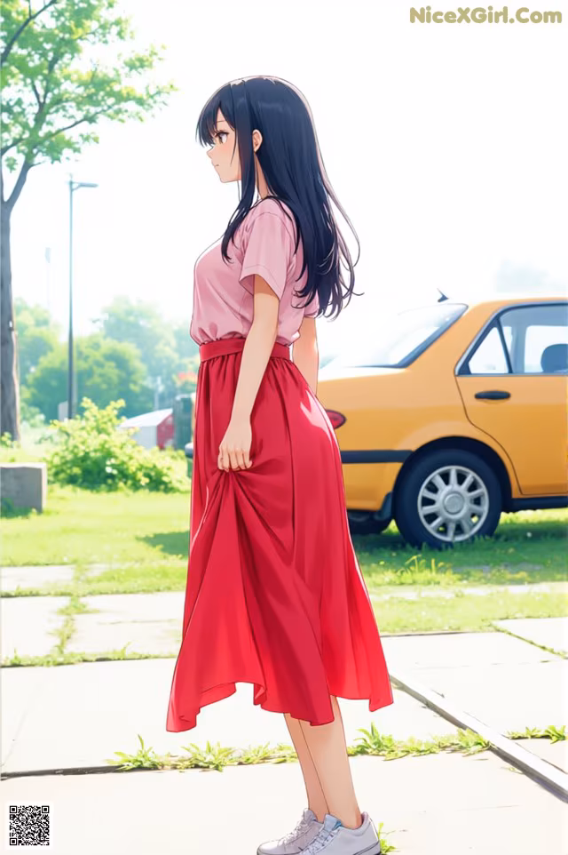 A woman in a pink shirt and red skirt standing on a sidewalk.