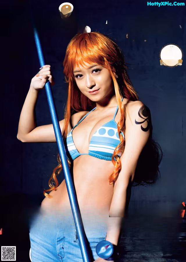 A woman in a bikini holding a baseball bat.
