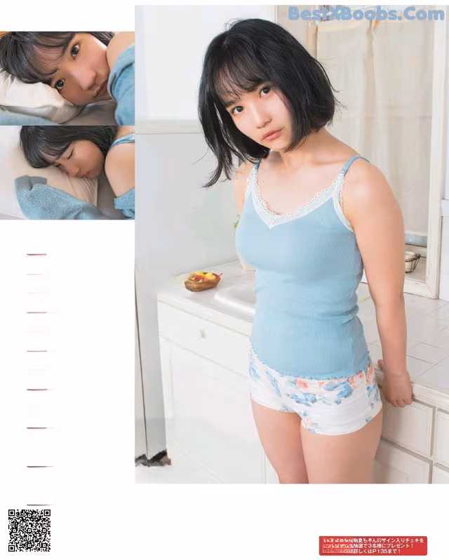 A woman in a blue tank top and white shorts in a bathroom.